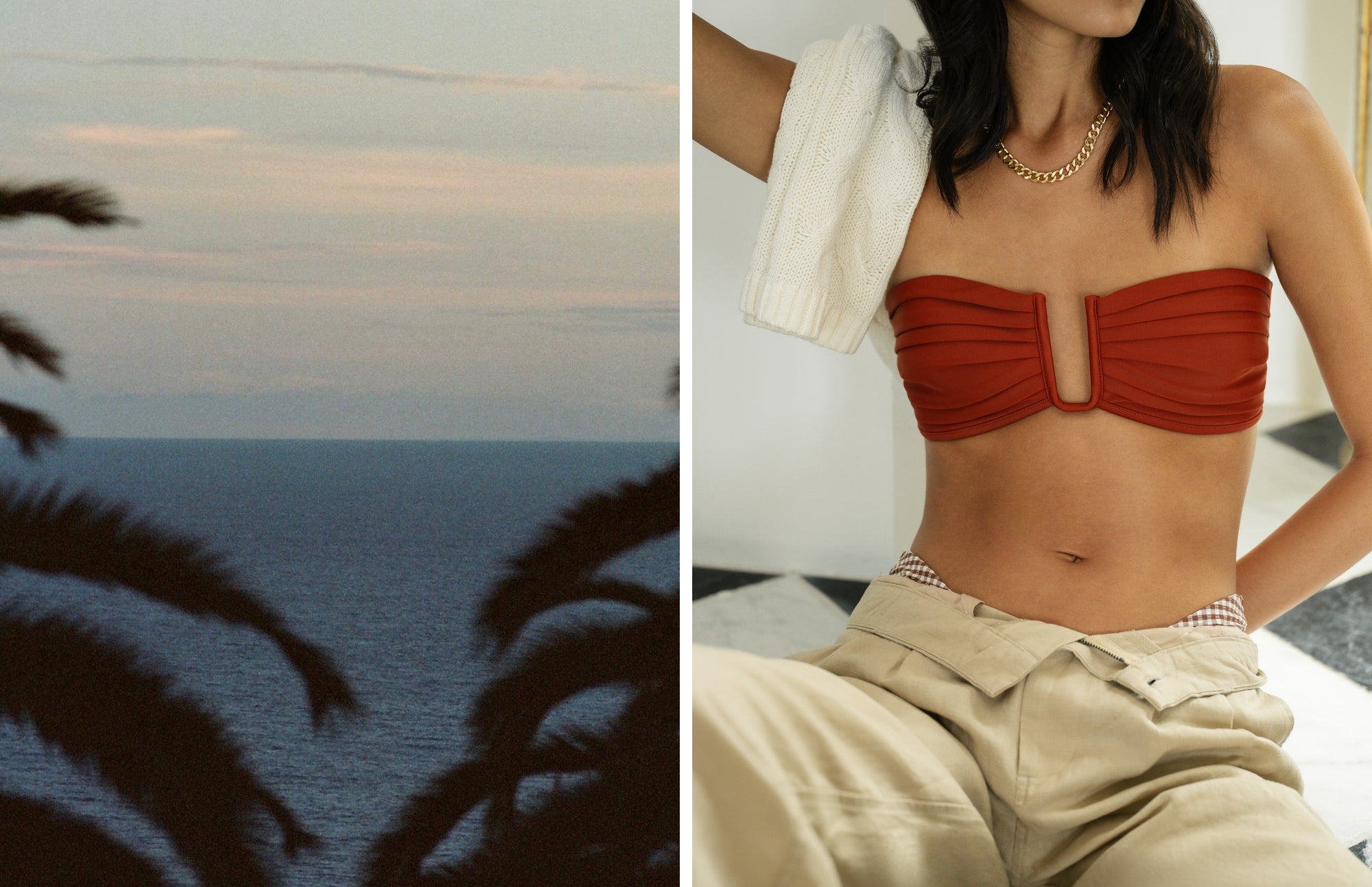 Woman in a red bikini top sitting by the ocean with palm trees.
