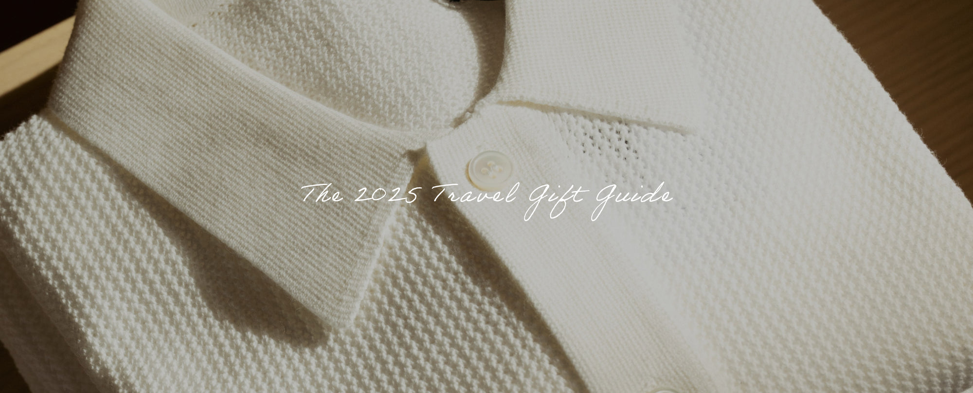 Close-up of a textured white garment with 'The 2023 Travel Gift Guide' text.